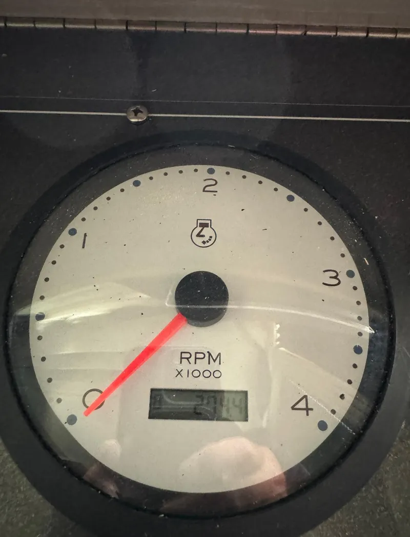 Slide: The Image of Close-up of a Thoroughbred 99 x 20 tachometer, showing RPM gauge. - 48