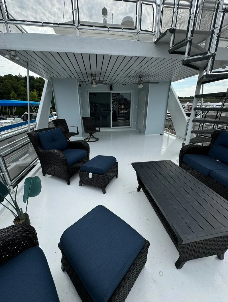 Slide: The Image of Spacious deck of 2002 Thoroughbred 99 x 20 with modern outdoor furniture. - 5