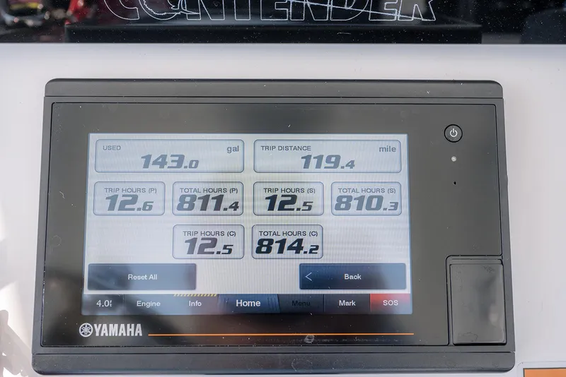 Slide: The Image of 2022 Contender 39 ST boat cockpit with advanced navigation system and open cabin door. - 12