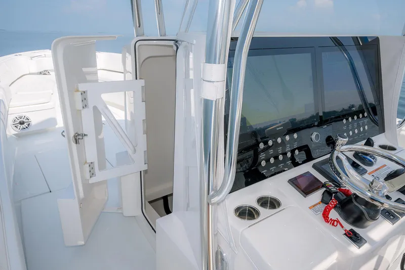 Slide: The Image of Contender 39 ST 2022 boat storage compartment with grid flooring and equipment. - 13