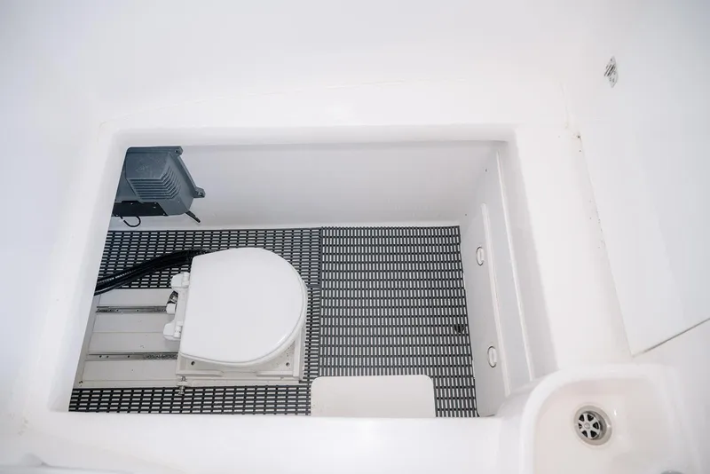 Slide: The Image of 2022 Contender 39 ST boat with tower against blue sky and water backdrop. - 14