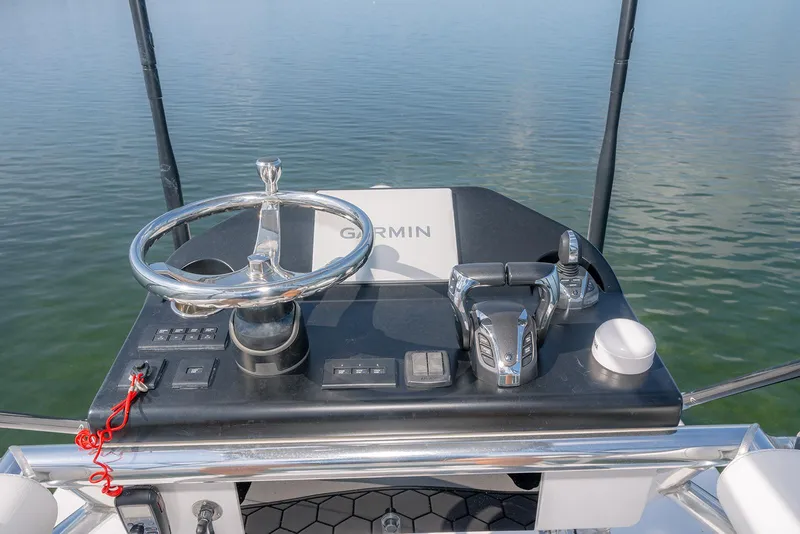 Slide: The Image of 2022 Contender 39 ST boat on calm water, front view. - 16