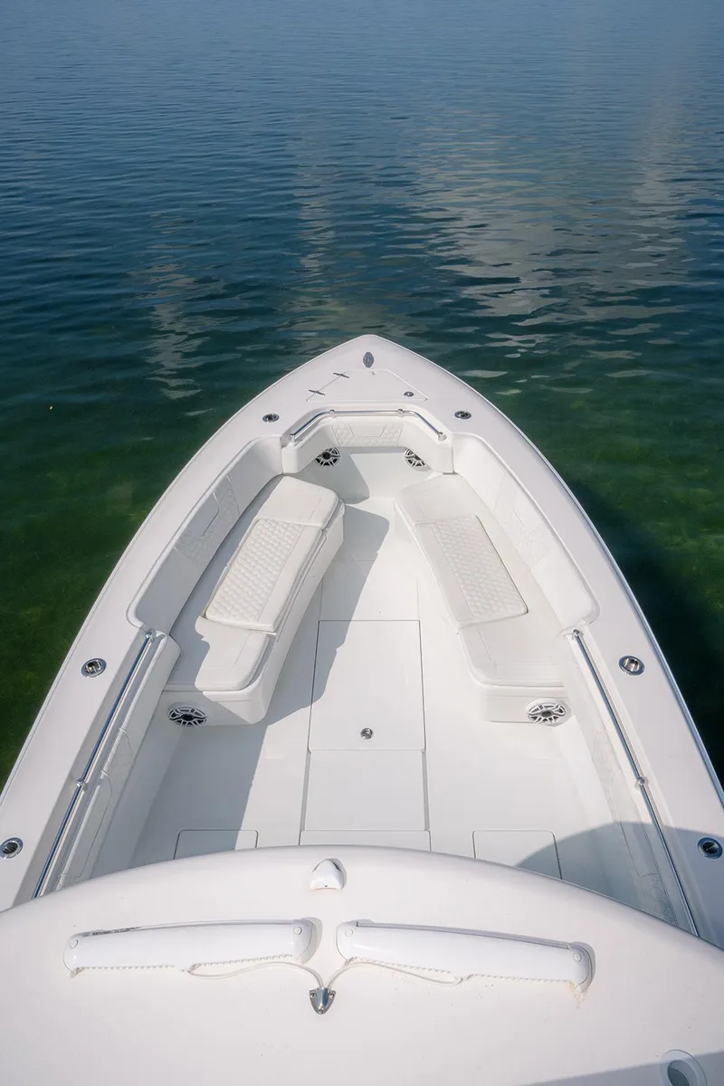 Slide: The Image of 2022 Contender 39 ST boat deck with seating, floating on clear water. - 19