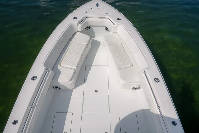 Slide: The Image of 2022 Contender 39 ST boat on calm ocean waters, featuring spacious seating. - 20