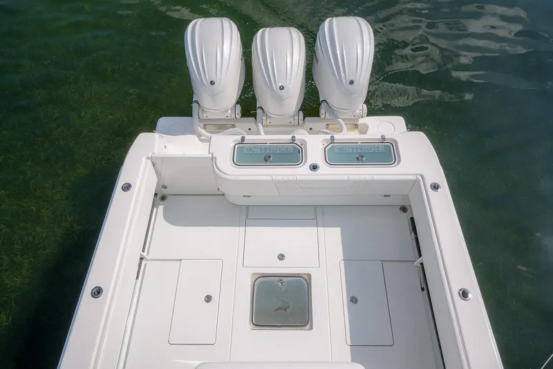 Slide: The Image of 2022 Contender 39 ST boat with triple engines, aerial view. - 3