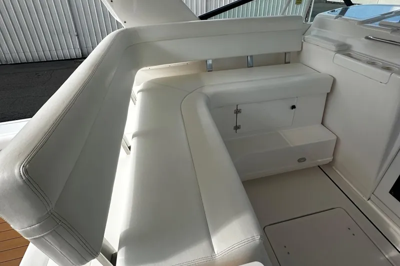 Slide: The Image of 1999 Tiara Yachts 43 Open interior seating with white upholstery. - 12