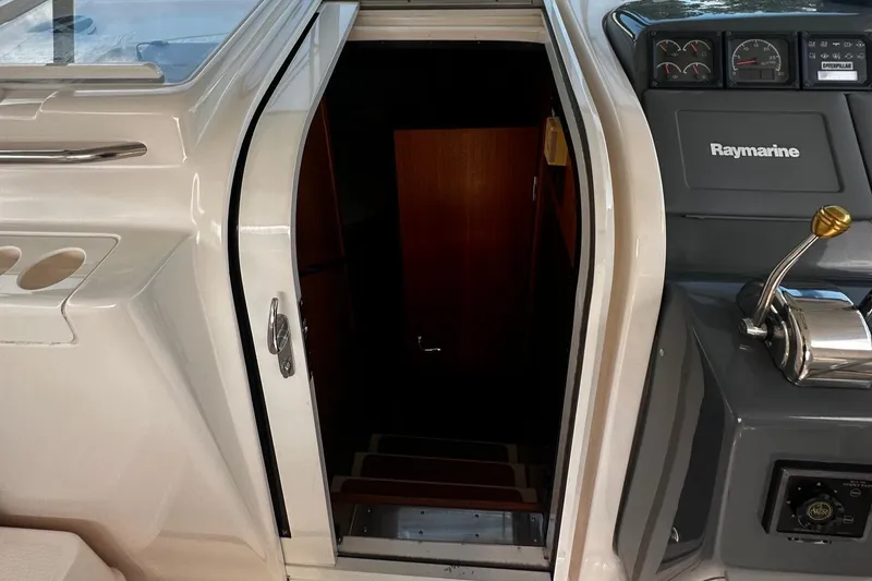 Slide: The Image of 1999 Tiara Yachts 43 Open cabin entrance with Raymarine navigation equipment. - 15