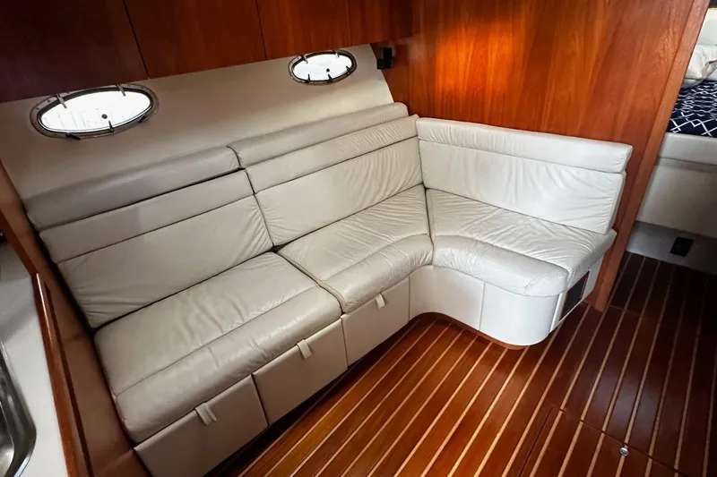 Slide: The Image of Luxurious interior of 1999 Tiara Yachts 43 Open with leather seating and wood flooring. - 19
