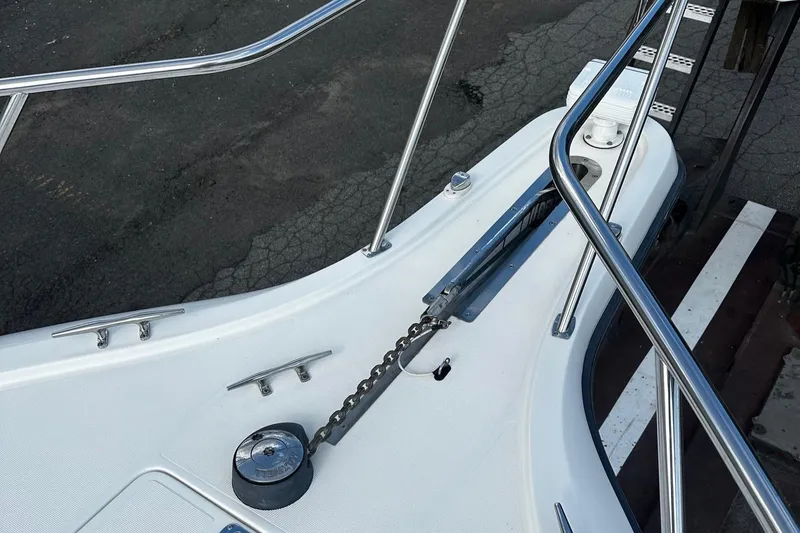 Slide: The Image of Bow of 1999 Tiara Yachts 43 Open with anchor chain and railing. - 30