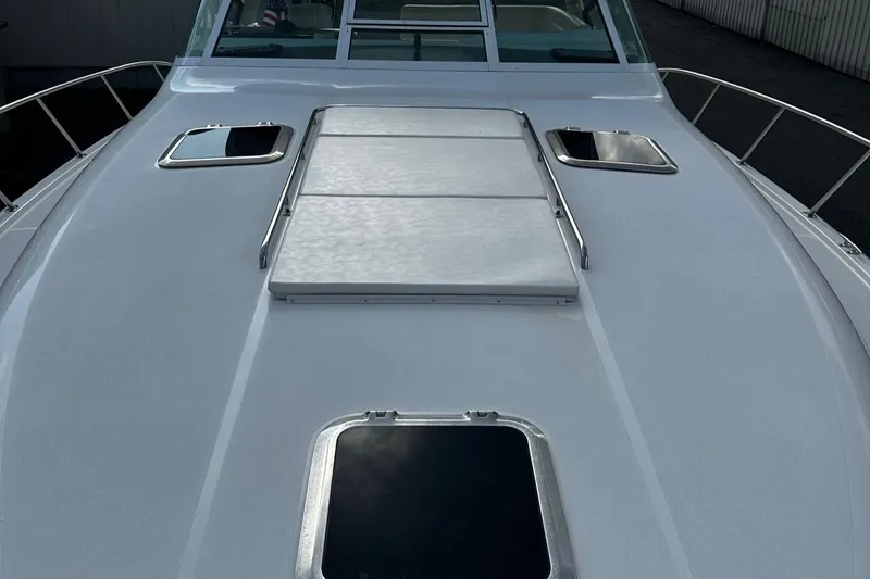 Slide: The Image of 1999 Tiara Yachts 43 Open deck with hatches and railing. - 31
