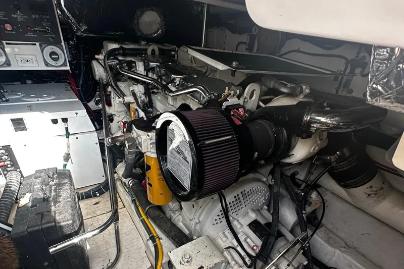 Slide: The Image of Engine room of a 1999 Tiara Yachts 43 Open, showcasing mechanical components and controls. - 9