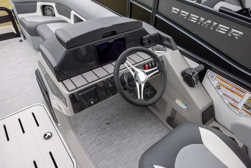 Slide: The Image of 2025 Premier 230 Solaris RF boat interior with modern steering console and seating. - 10