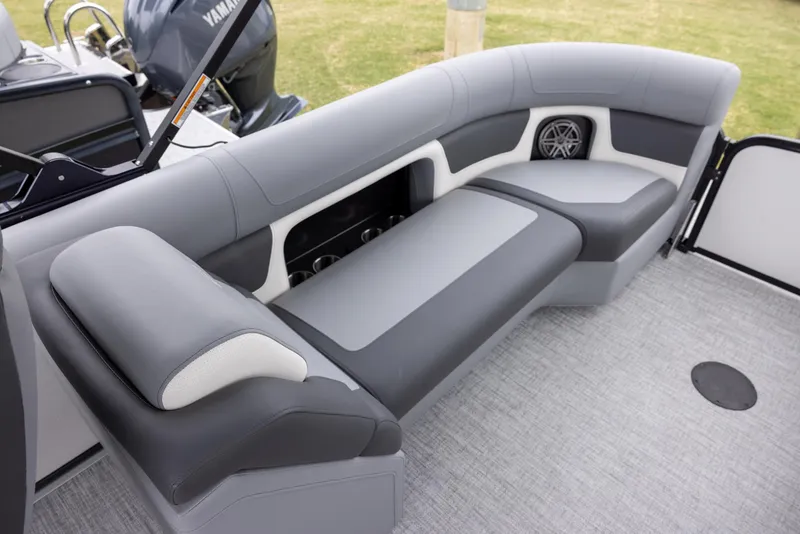Slide: The Image of Premier 230 Solaris RF 2025 boat interior with gray seating and speaker system. - 11
