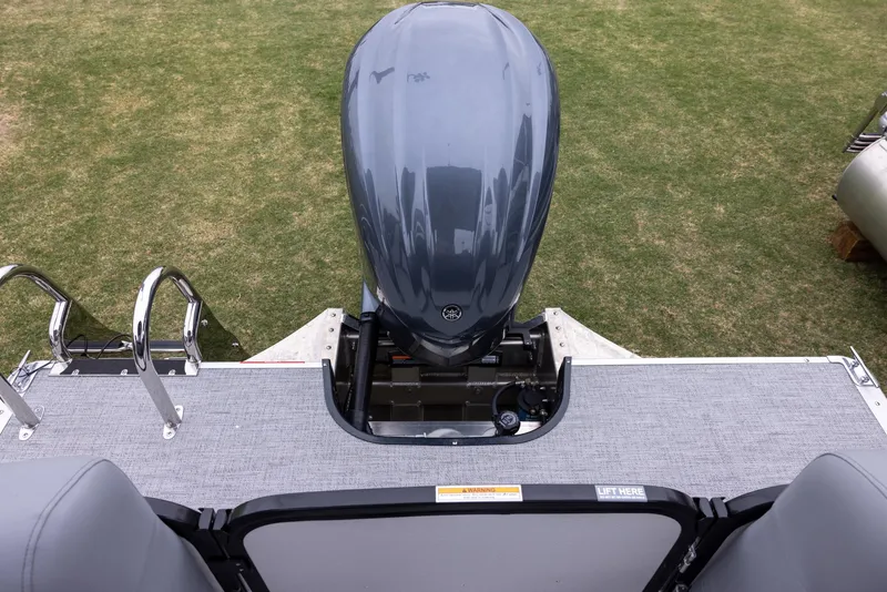 Slide: The Image of 2025 Premier 230 Solaris RF boat with outboard motor on grassy area. - 13
