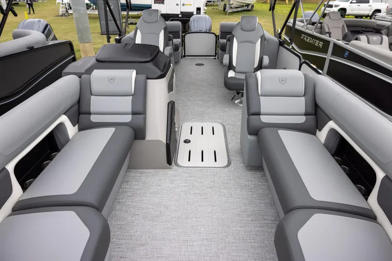Slide: The Image of 2025 Premier 230 Solaris RF pontoon boat interior with gray seating and spacious layout. - 5