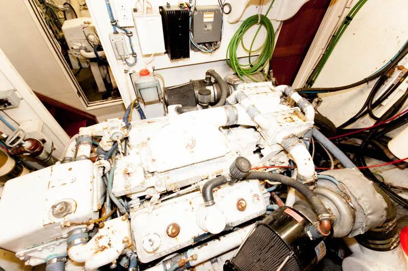 Slide: The Image of Engine room of 1980 Hatteras 58 Motor Yacht with visible machinery and equipment. - 38