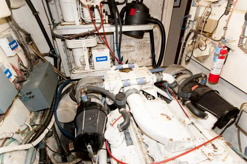 Slide: The Image of Engine room of 1980 Hatteras 58 Motor Yacht with visible machinery and equipment. - 42