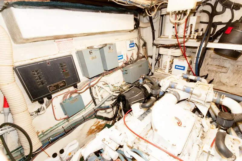 Slide: The Image of Engine room of 1980 Hatteras 58 Motor Yacht with electrical panels and machinery. - 44