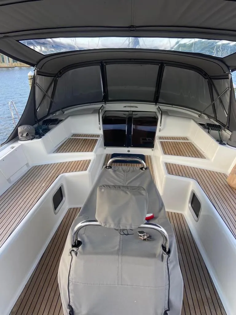Slide: The Image of 2016 Jeanneau 58 yacht deck with sleek design and spacious seating area. - 11