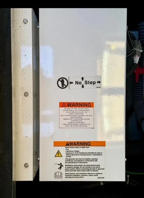 Slide: The Image of Electrical panel with warning labels on a 2016 Jeanneau 58 yacht. - 16