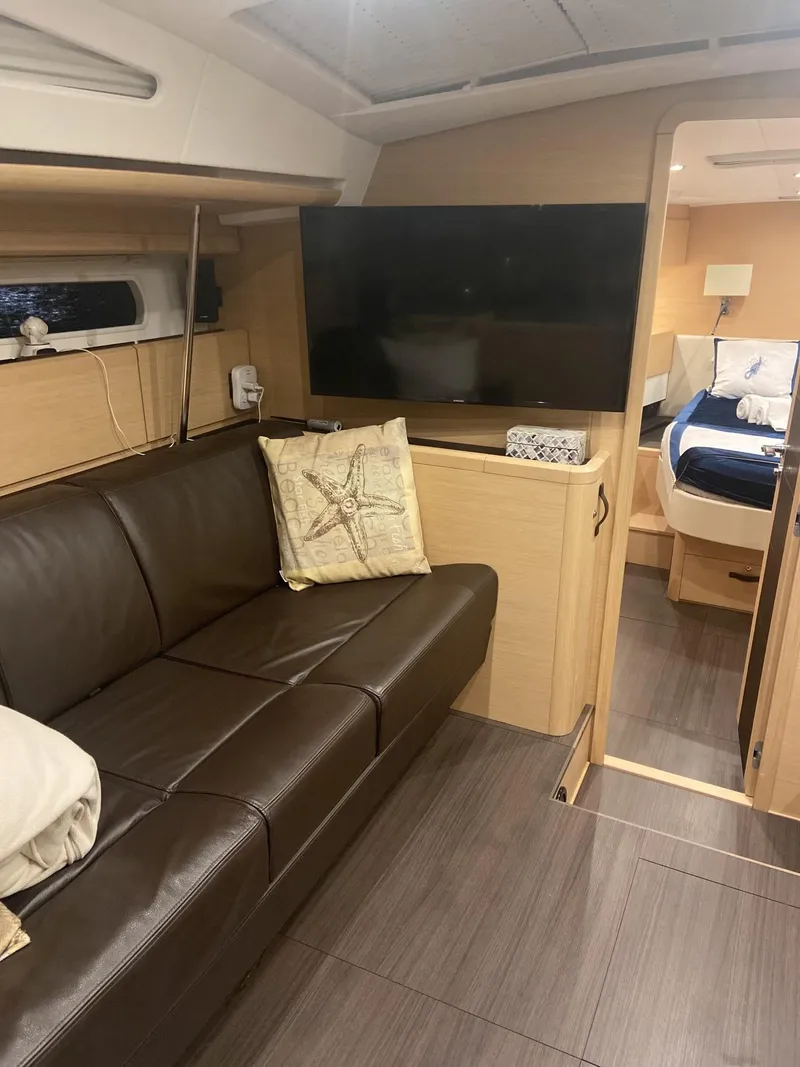 Slide: The Image of Interior of 2016 Jeanneau 58 yacht with leather seating and modern decor. - 7