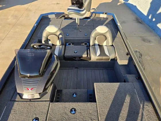 Slide: The Image of 2025 Vexus AVX1980C boat interior with seating and steering console. - 2