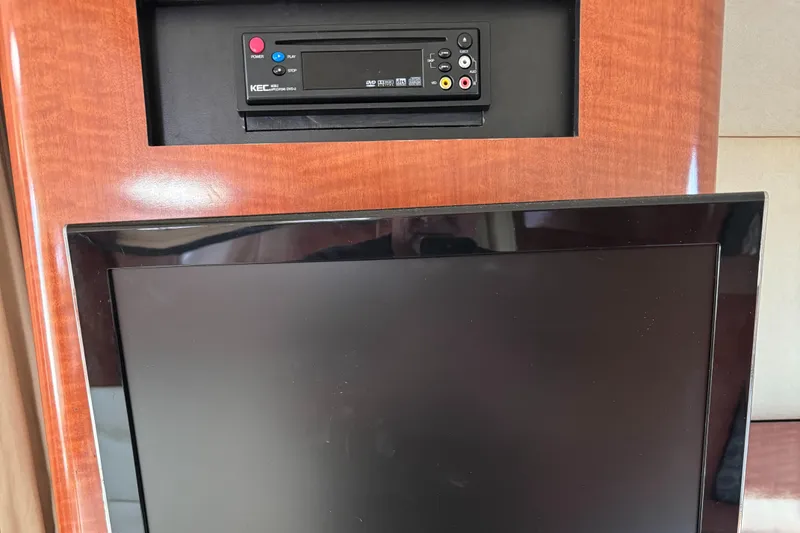 Slide: The Image of Entertainment system in 2004 Sea Ray 320 Sundancer yacht interior. - 13