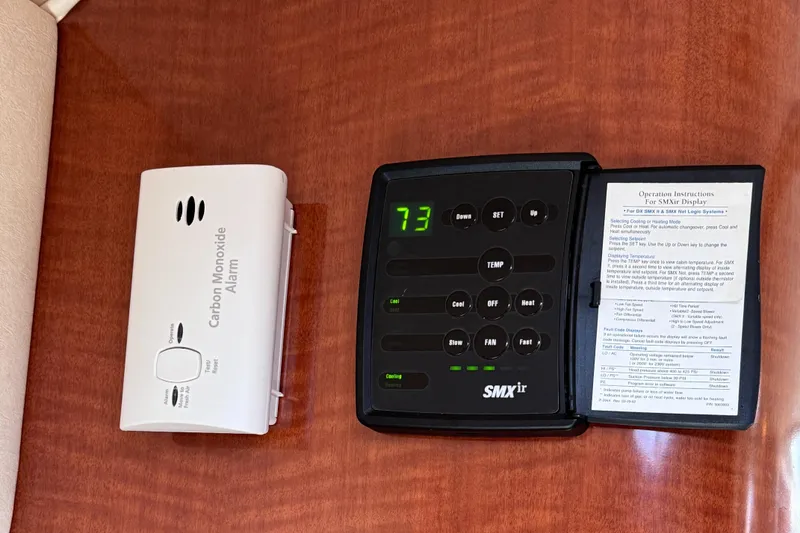 Slide: The Image of Carbon monoxide alarm and SMXir control panel on 2004 Sea Ray 320 Sundancer yacht. - 14