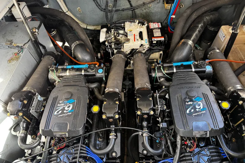 Slide: The Image of Engine room of 2004 Sea Ray 320 Sundancer with twin Mercury engines. - 21