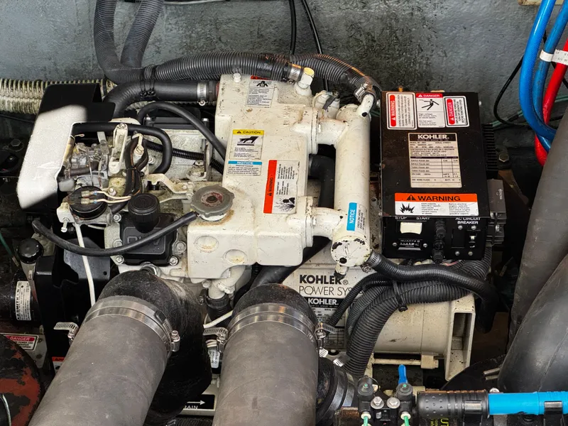 Slide: The Image of Engine compartment of a 2004 Sea Ray 320 Sundancer with Kohler power system. - 22