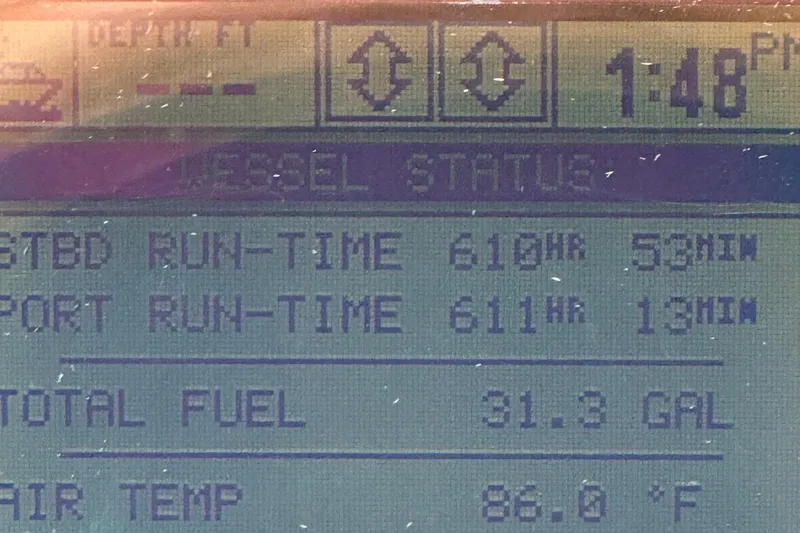 Slide: The Image of Display screen showing engine run-time and fuel status on 2004 Sea Ray 320 Sundancer. - 6