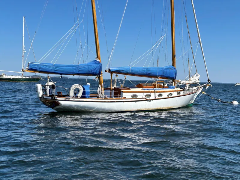 Slide: The Image of 1985 Herreshoff Nereia Molly's Cove 38' sailboat with FRP hull on water. - 17