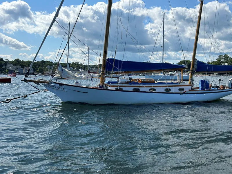 Slide: The Image of 1985 Herreshoff Nereia Molly's Cove 38' sailboat with FRP hull on water. - 19