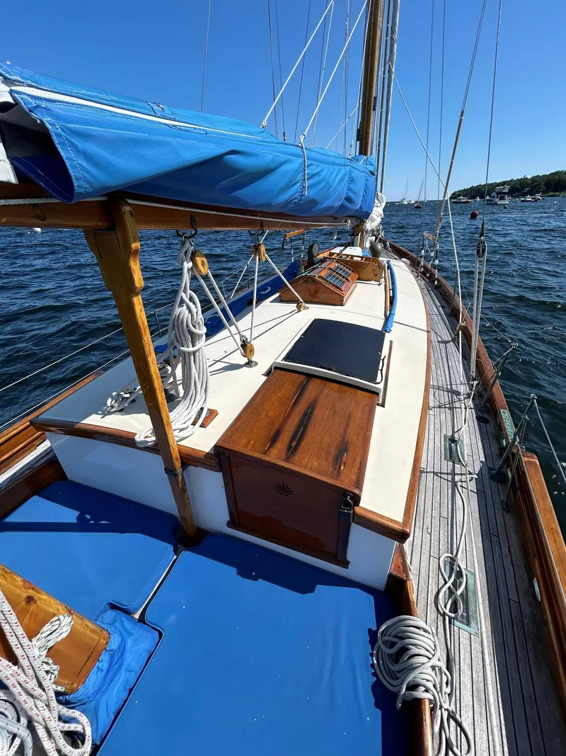 Slide: The Image of 1985 Herreshoff Nereia Molly's Cove 38' sailboat with FRP hull, docked on a sunny day. - 29