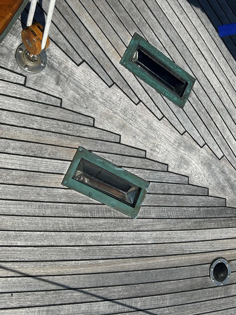 Slide: The Image of Teak deck of 1985 Herreshoff Nereia Molly's Cove 38' with FRP hull, featuring skylights. - 32