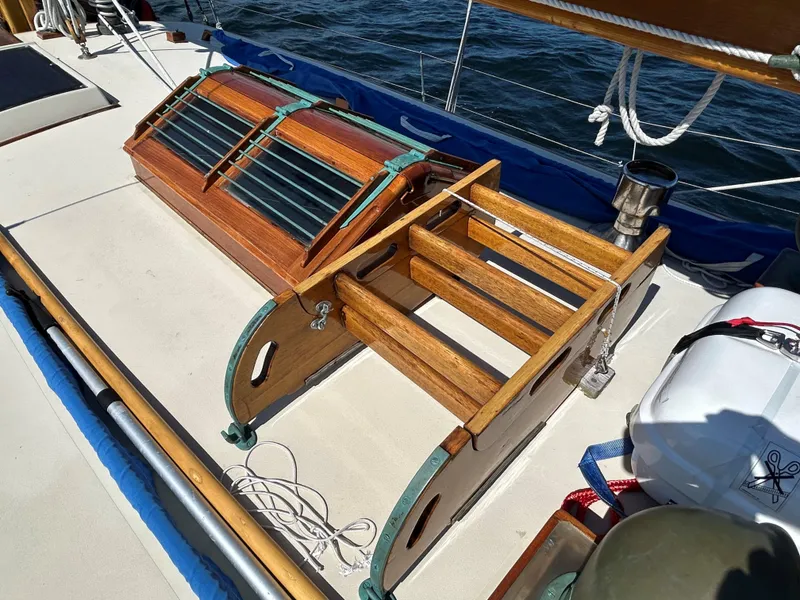 Slide: The Image of 1985 Herreshoff Nereia Molly's Cove 38' sailboat deck with wooden hatch and steps. - 33