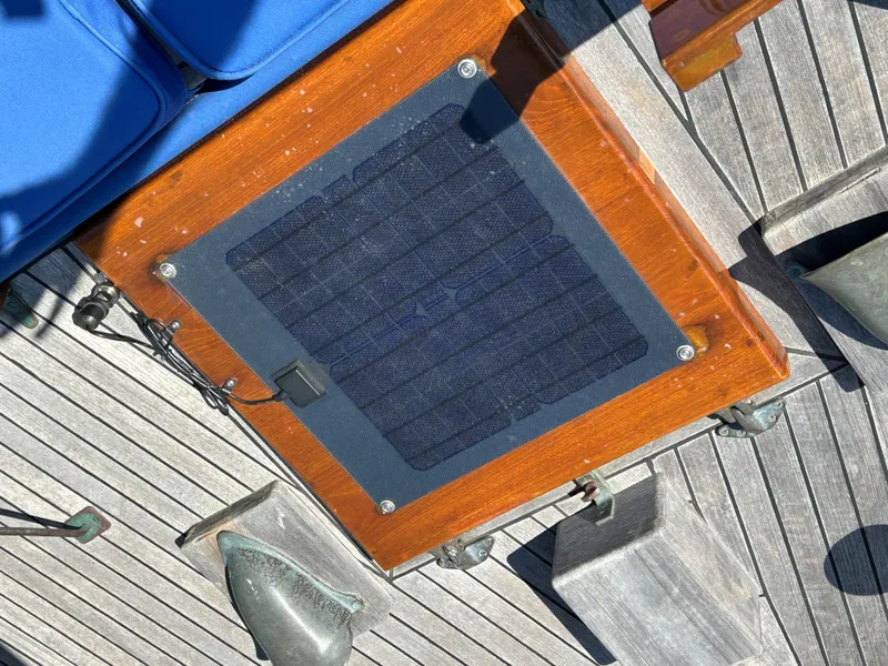 Slide: The Image of Wooden deck with solar panel on 1985 Herreshoff Nereia Molly's Cove 38' sailboat. - 36