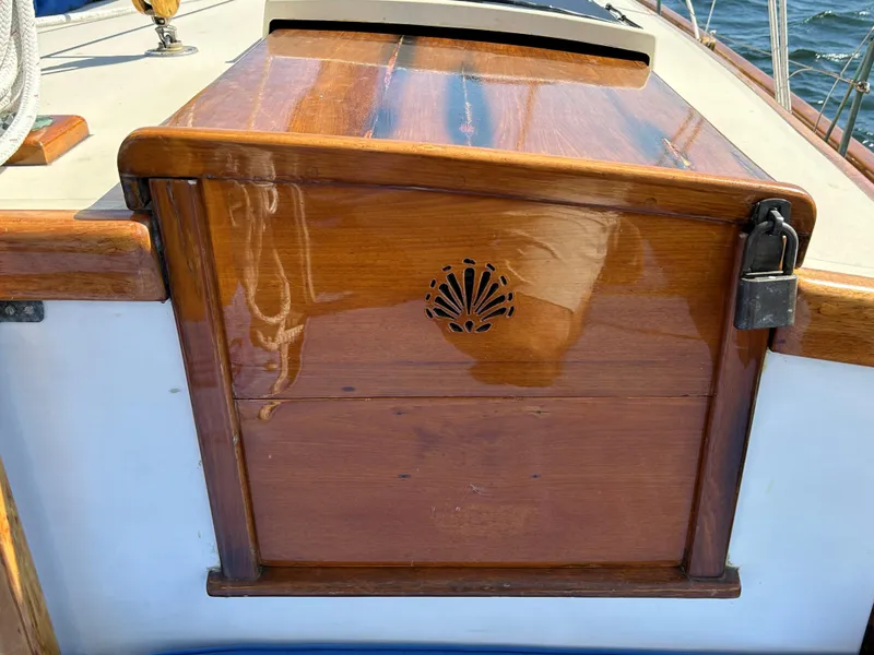 Slide: The Image of 1985 Herreshoff Nereia Molly's Cove sailboat with polished wooden hatch and decorative carving. - 39