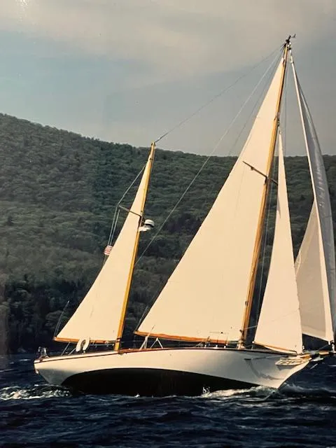 Slide: The Image of 1985 Herreshoff Nereia Molly's Cove 38' sailboat with FRP hull on open water. - 6