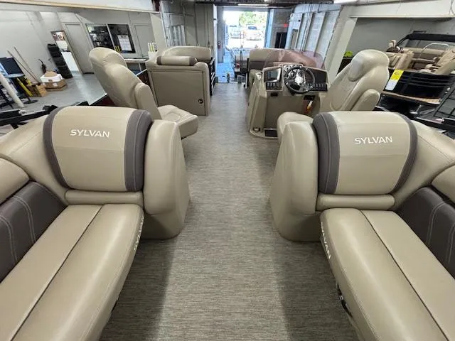 Slide: The Image of 2022 Sylvan Mirage X X3 pontoon boat interior with luxurious seating and modern design. - 10