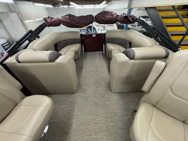 Slide: The Image of 2022 Sylvan Mirage X X3 pontoon boat interior with beige seating and spacious layout. - 13