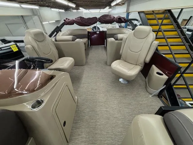 Slide: The Image of 2022 Sylvan Mirage X X3 pontoon boat interior with beige seating and modern design. - 15