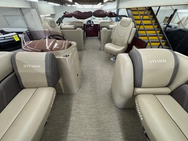 Slide: The Image of 2022 Sylvan Mirage X X3 boat interior with beige seating and modern design. - 16