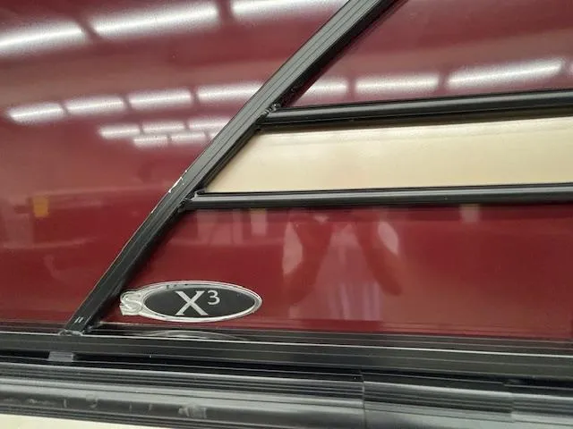 Slide: The Image of 2022 Sylvan Mirage X X3 boat detail with maroon and beige paneling. - 19