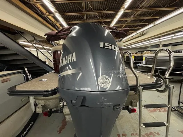 Slide: The Image of 2022 Sylvan Mirage X X3 with Yamaha 150 engine in a showroom. - 20