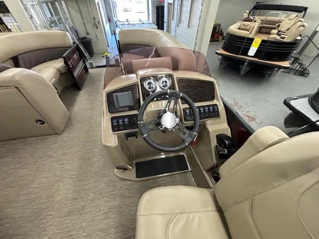 Slide: The Image of 2022 Sylvan Mirage X X3 boat interior with steering console and seating. - 3
