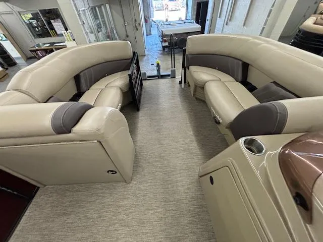 Slide: The Image of 2022 Sylvan Mirage X X3 boat interior with beige seating and modern design. - 7