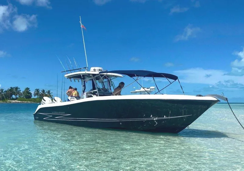 The Image of 2004 Hydra-Sports Vector 3300 CC boat anchored in clear tropical waters. - 1