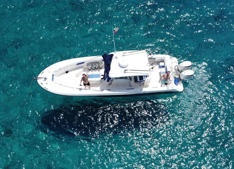 Slide: The Image of 2004 Hydra-Sports Vector 3300 CC boat on clear blue water, aerial view. - 3