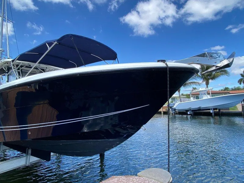 Slide: The Image of 2004 Hydra-Sports Vector 3300 CC boat docked on a sunny day. - 5